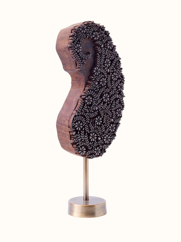 angled view of sheesham wood carved paisley wooden block
