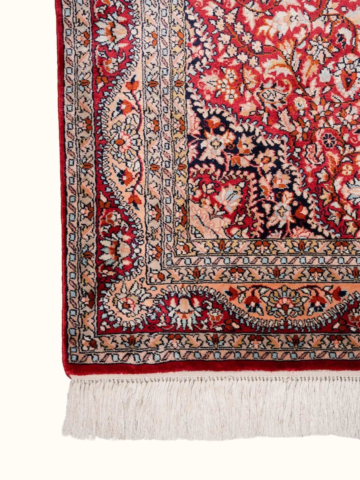 Detail view of Traditional Persian Red Kashan Kashmir Silk Hand-Knotted Carpet highlighting the intricate pattern and pile texture