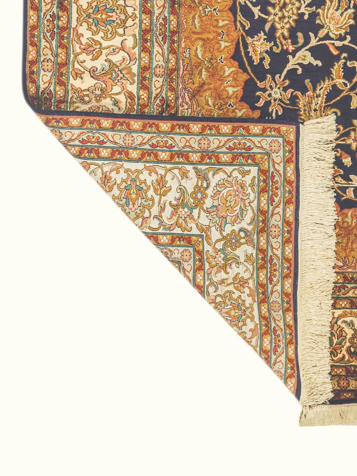 Side-angle view of the Traditional Persian Navy Rust Isfahan Kashmir Silk Hand-Knotted Carpet