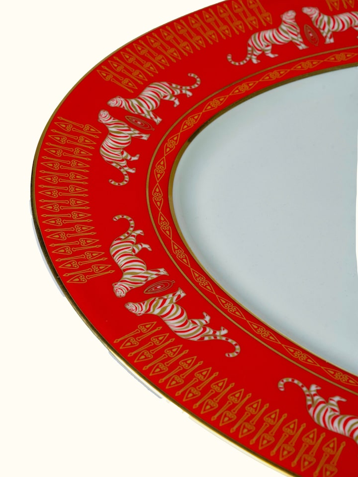 Detail view of Oval Ceramic Serving Platter With Gold-Accented, Glaze-Set Motifs highlighting the handcrafted detailing and finish