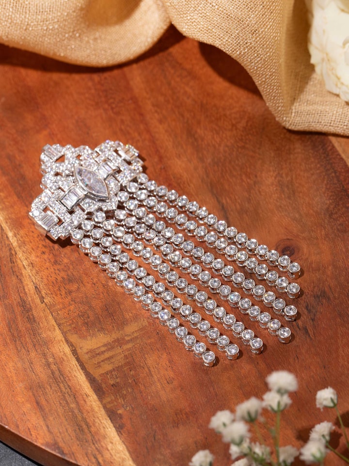 Styled detail view of Silver Smithing Brooch Pin pinned onto fabric, shown in another styled shot