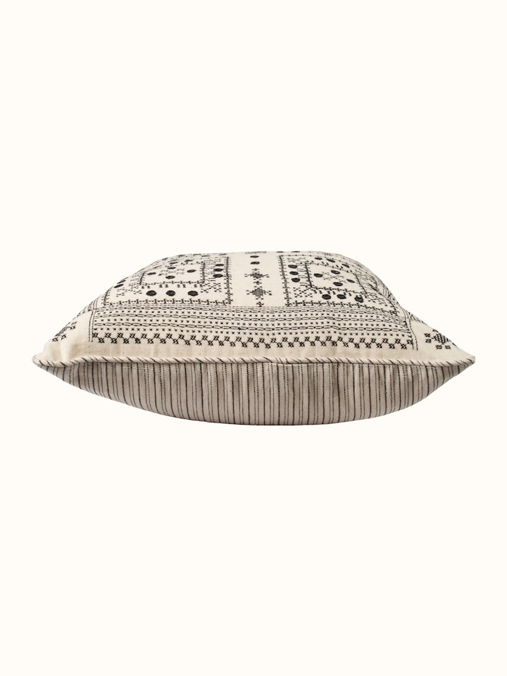Folk geo hand embroidered checkered cushion cover, angled view highlighting pattern