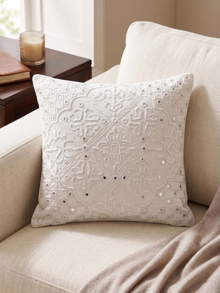 Front view of the Swadesh Lippan White Pakko Medallion Hand Embroidered Cotton Cushion Cover