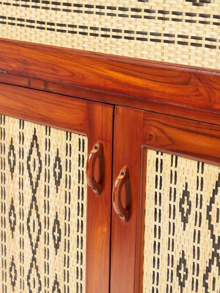 Top-down view of teak wood and cane bar cabinet, emphasizing the cabinet’s spacious design and elegant finish.