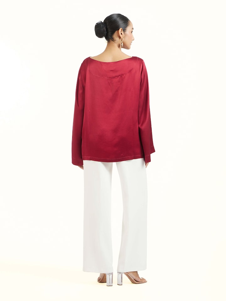 Back view of red satin Shibori top displaying complete design