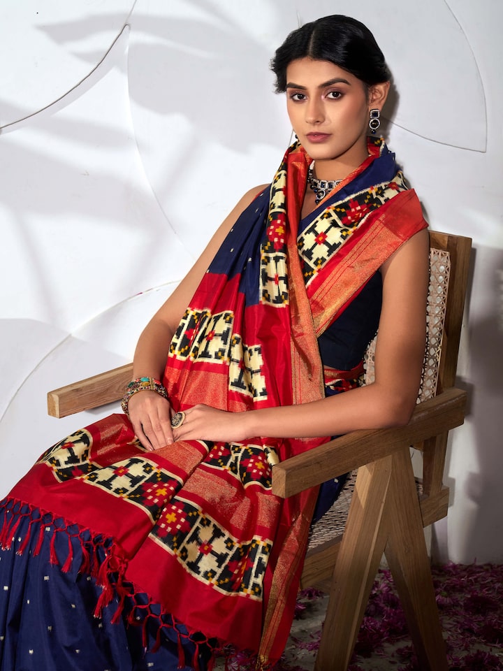 Detail view of blue silk Pochampally double ikat saree showcasing craftsmanship