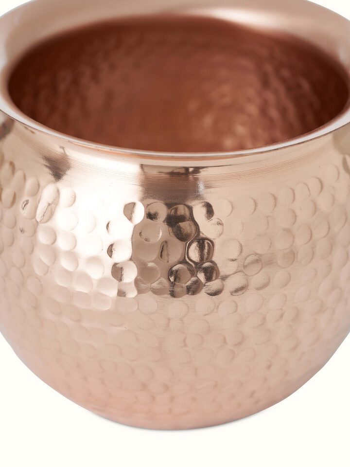 Close-up view of Polished copperware kalash