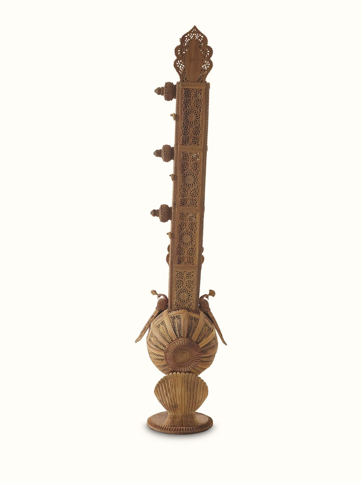 Full sandalwood veena sculpture with a focus on the artistic design and detailed carvings.