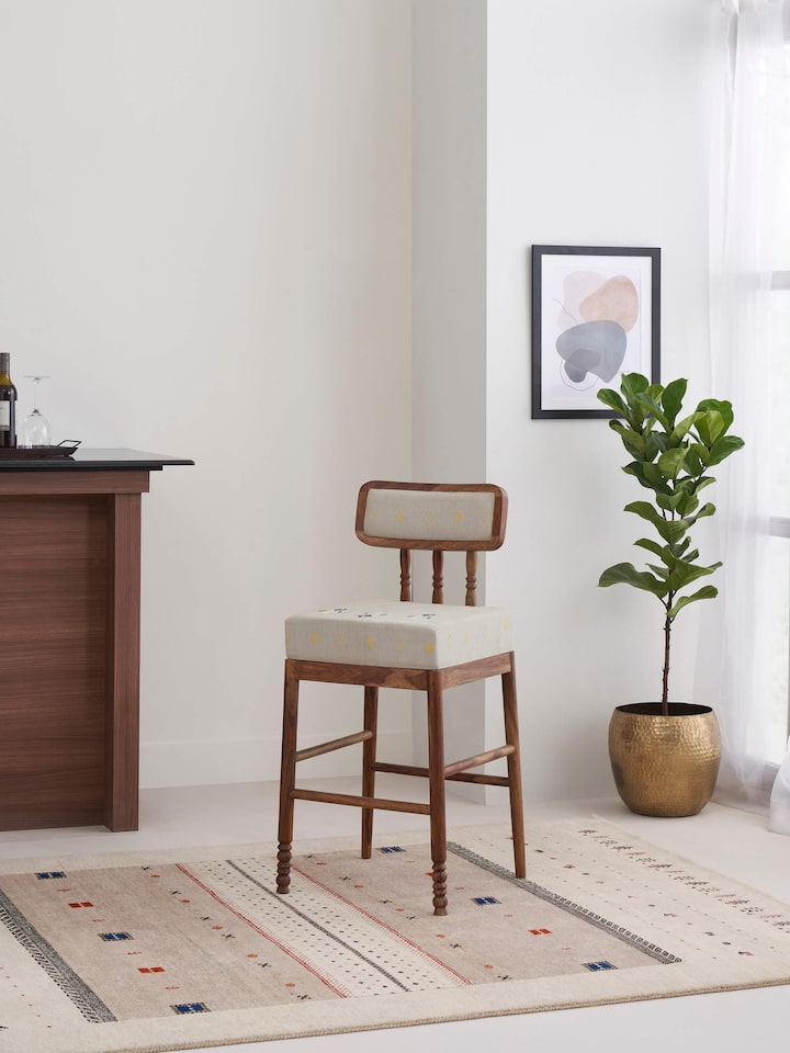 Side view of Upholstered Sheesham Wood Bawan Buti Bar Stool highlighting wood and upholstery