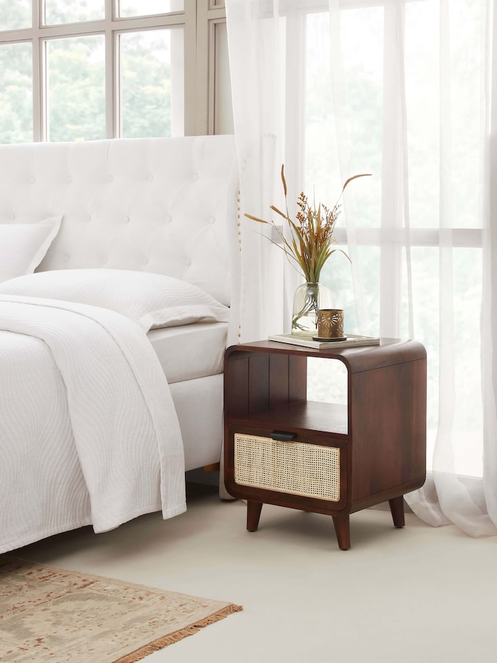 Side view of Swadesh Mango Wood & Cane Bedside Table highlighting its elegant design and natural wood finish