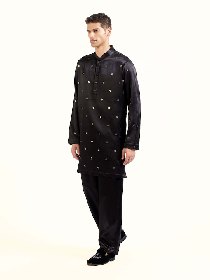 Side view of black hand embroidery long kurta showcasing tailored fall