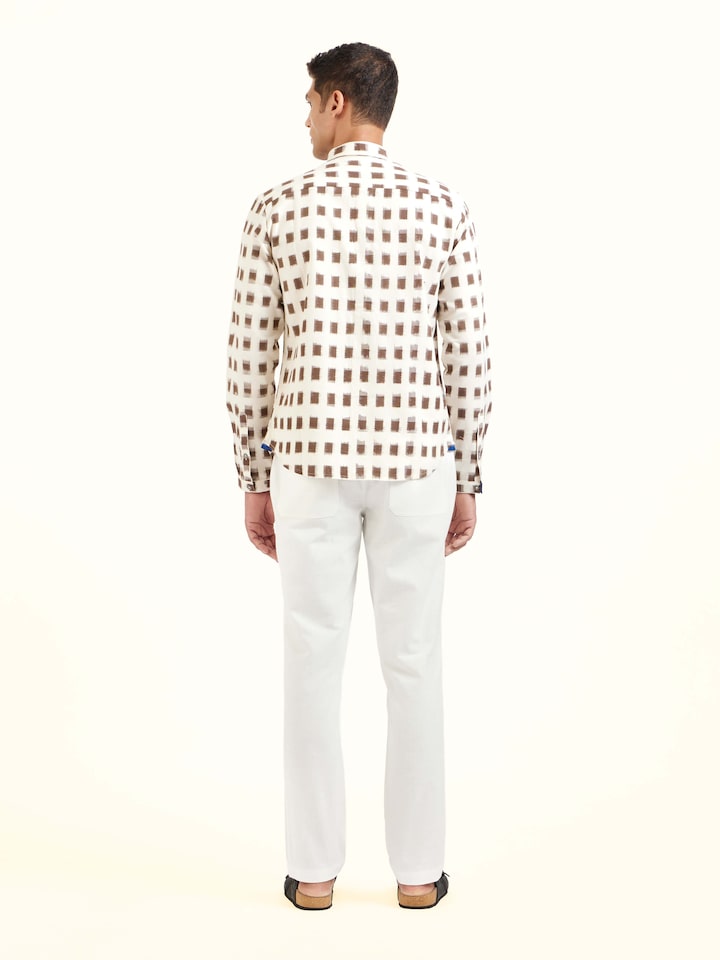 Back view of white cotton Telangana Ikat shirt displaying overall design