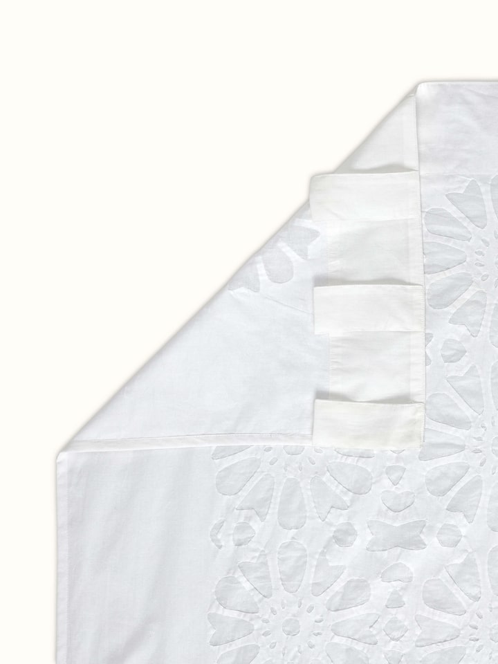 Back view of Mandana cotton sheer curtain with finished hem and translucent appeal
