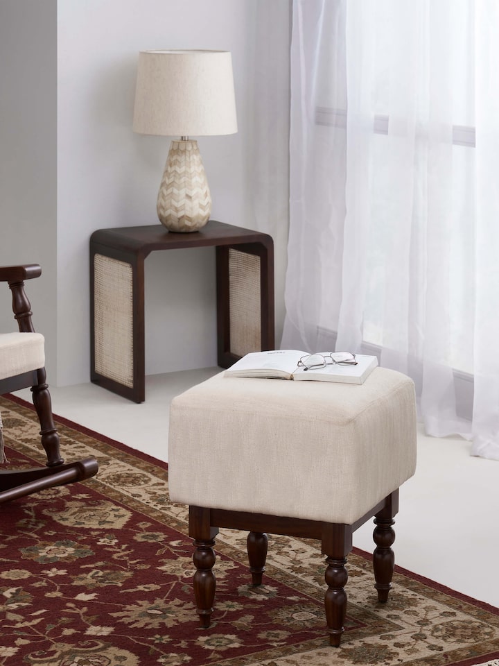 Side view of the upholstered Sheesham wood octagonal ottoman, highlighting its structure and upholstery.