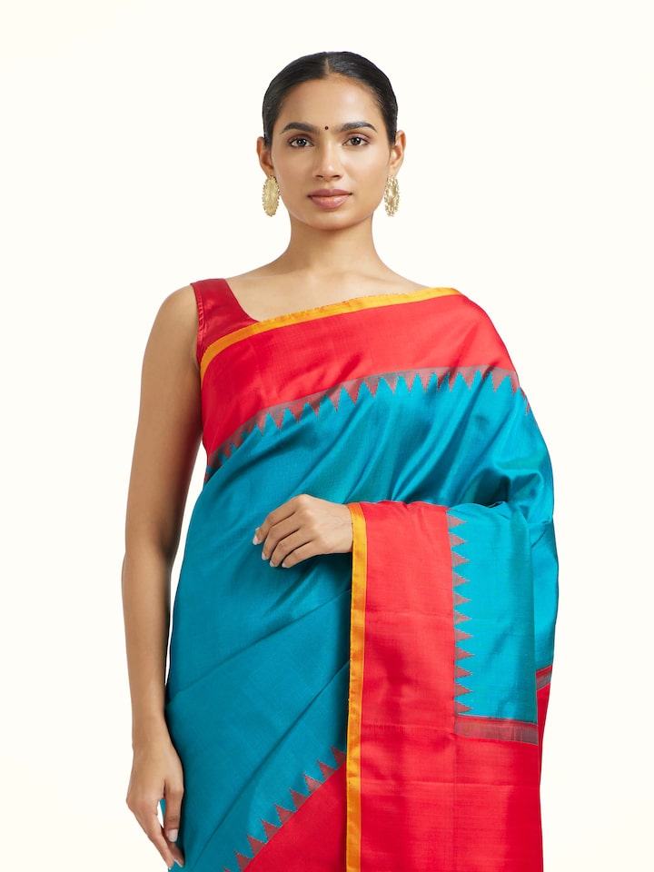 Angled view of the Blue Mulberry Silk Gadwal Handloom Zari Saree