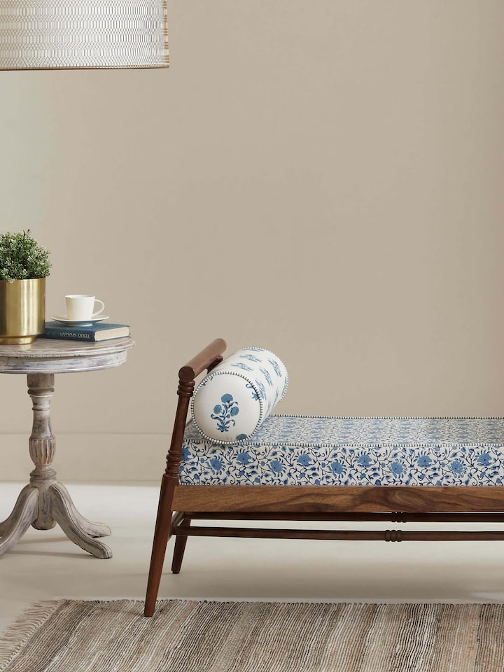 Side view of the Sheesham wood bench highlighting the slanted legs and block print design