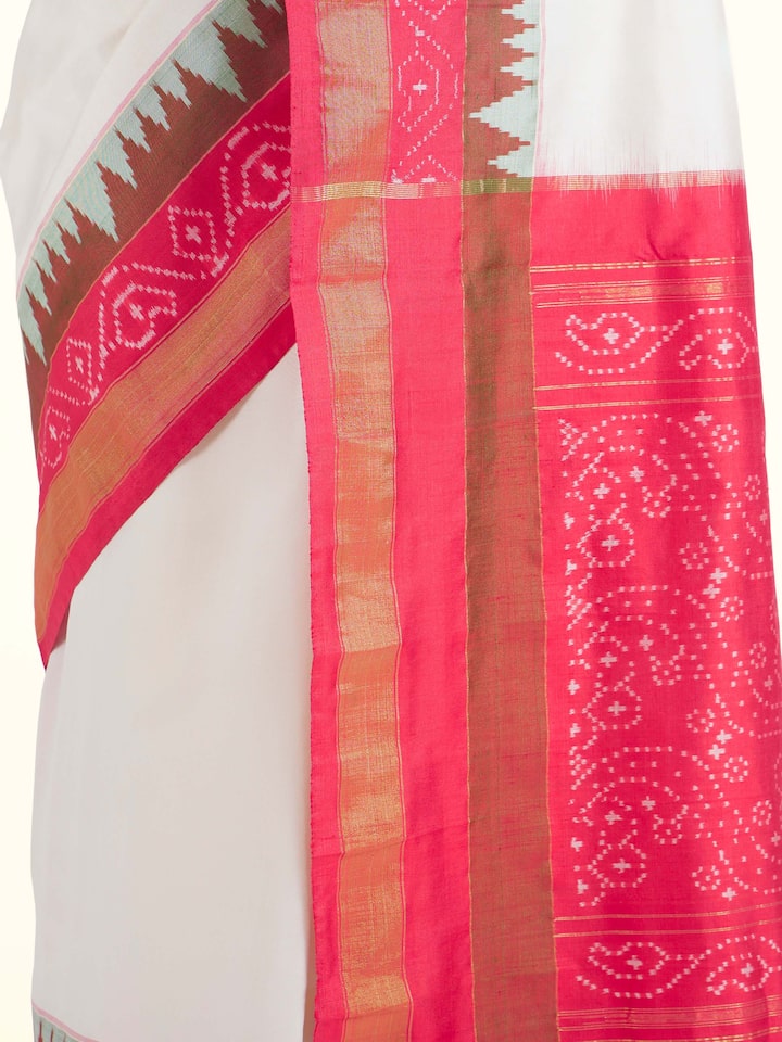 Detail view of off-white mulberry silk ikat saree highlighting fabric texture and ikat weave
