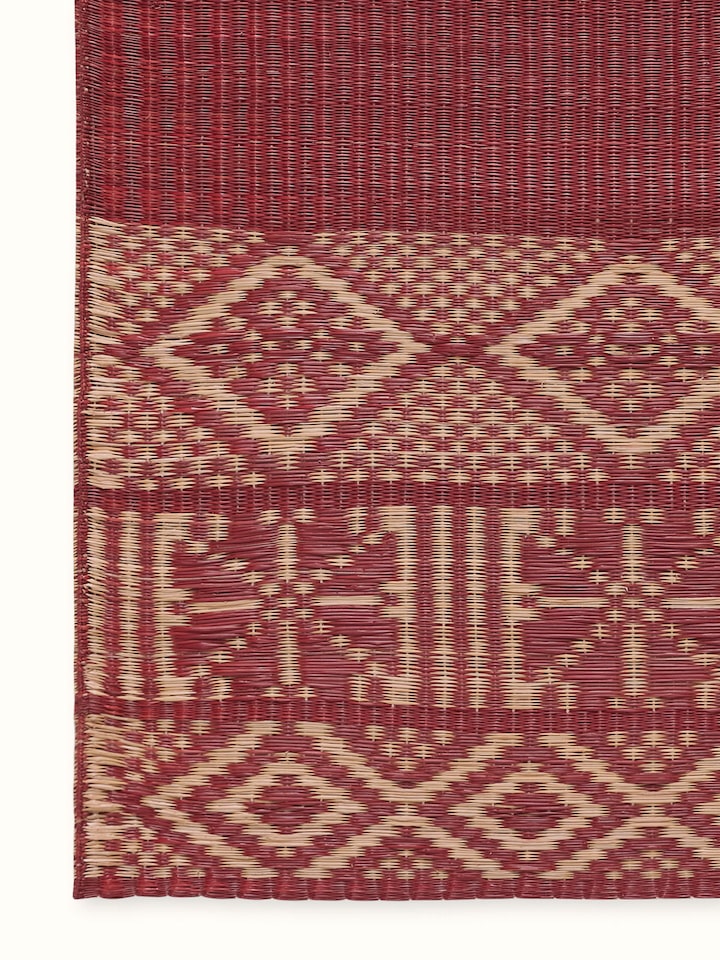 Detail view of Prakriti Red Folk Geo Natural Fibre Madurkathi Table Runner (6 Seater) highlighting the fabric texture and embroidery detail