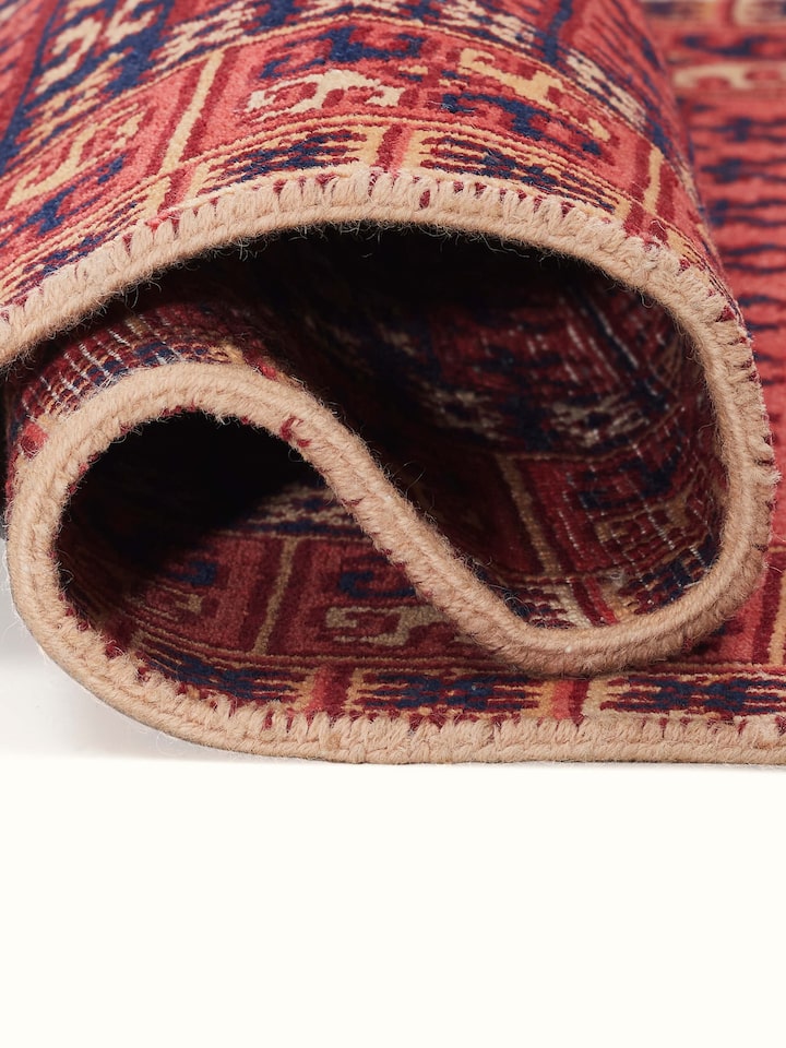 Side view emphasizing the dense pile and texture of the wool carpet