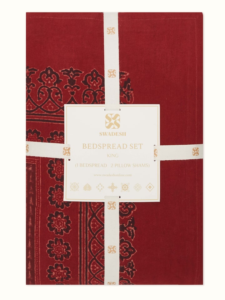Sindh maroon jaal cotton ajrakh block printed king bedspread set (3 pcs) folded to display the ajrakh print and fabric quality.