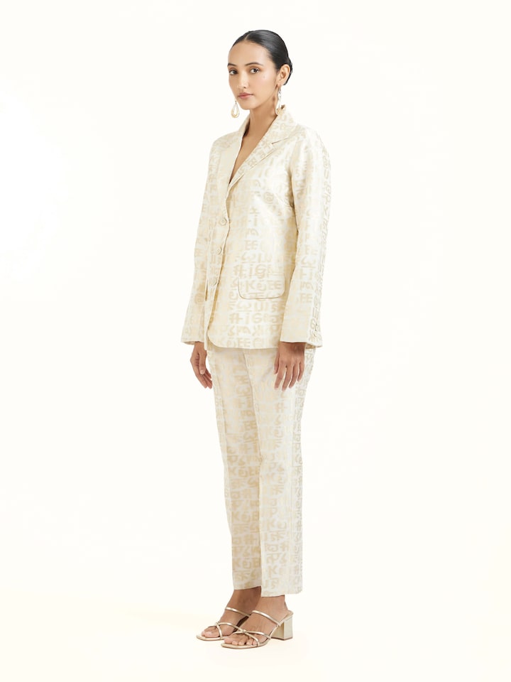 Side view of ivory handloom cut work calligraphy co-ord set highlighting structured silhouette