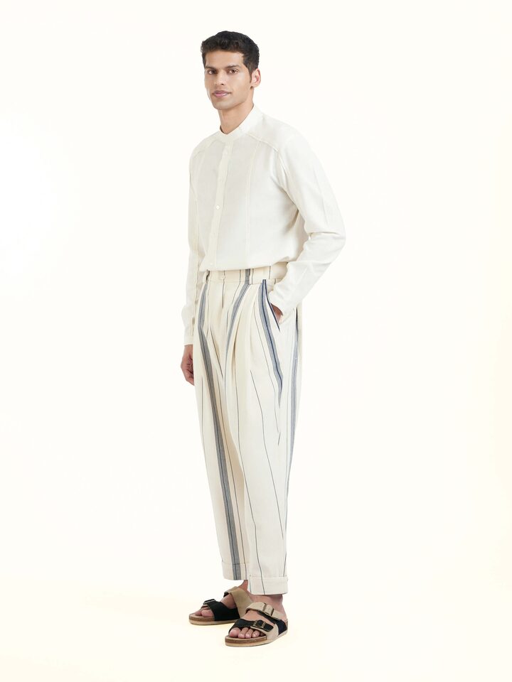 Side view of ivory cotton handloom straight pants showing fit and structure