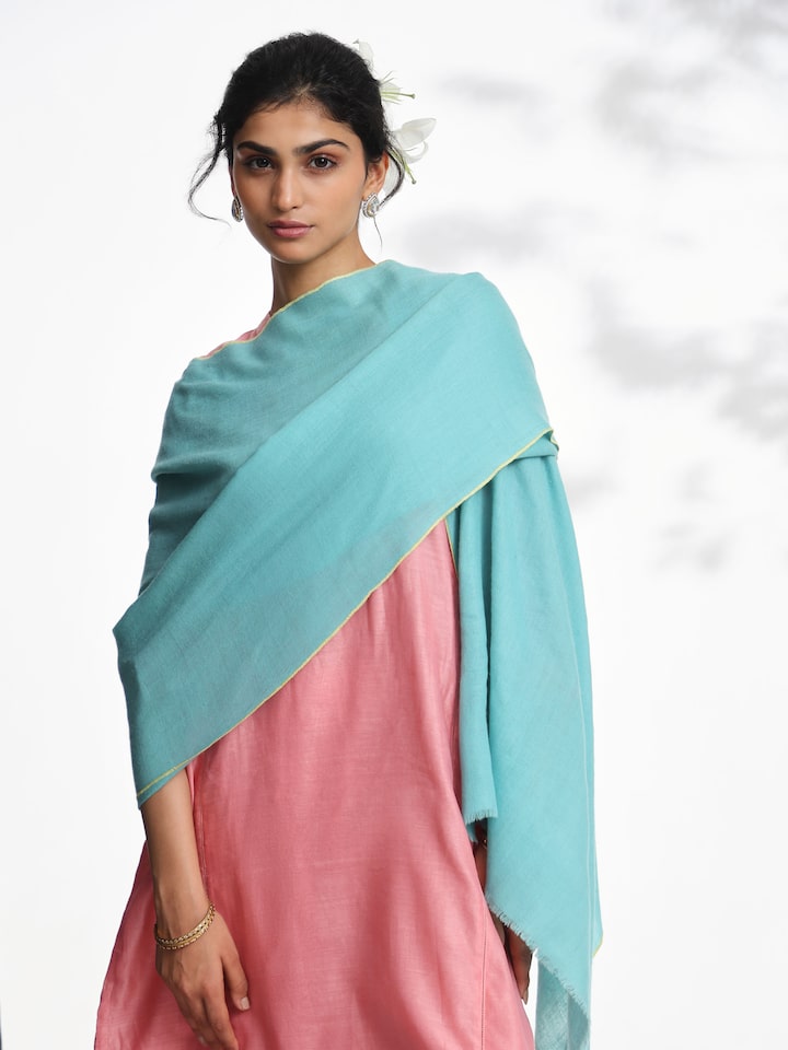 Angled view of teal cashmere kaaj embroidered handwoven stole highlighting detailed kaaj embroidery