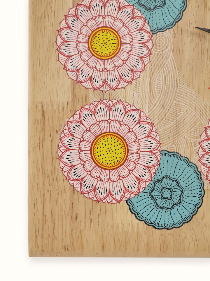 Detail shot of painted Pattachitra Lakshmi wooden wall clock showing fine details