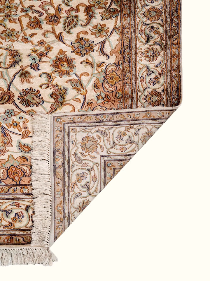 Back view of Traditional Persian Ivory Rust Kashan Kashmir Silk Hand-Knotted Carpet showing the reverse weave