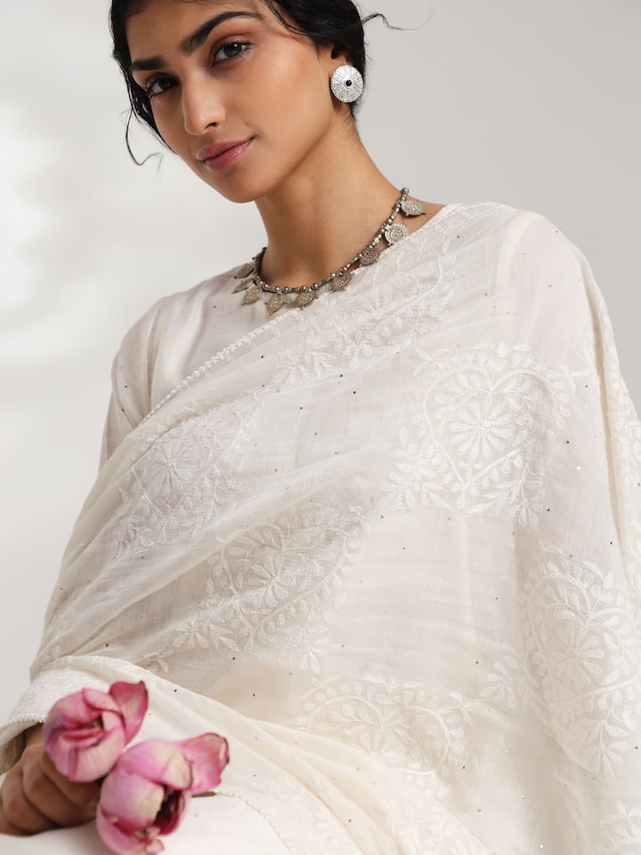 Side view of elegant chikankari patterns on off-white dupatta