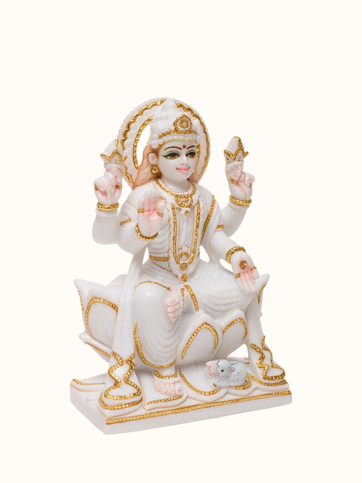 Angled view of the Marble Carved Lakshmi Idol