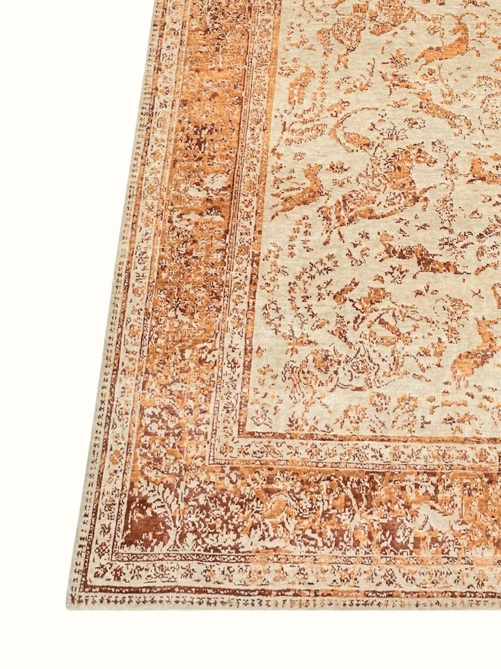 Close-up view of Transitional Persian Ivory Rust Shikargah Bhadohi Wool & Bamboo Silk Hand Knotted Rug highlighting the hand-knotted weave and moti...