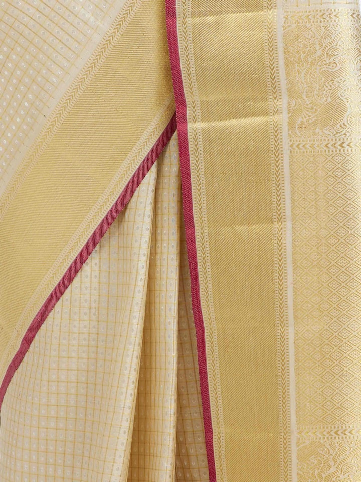 Detailed view of Beige Kancheepuram Silk Zari Saree focusing on the fine craftsmanship and texture