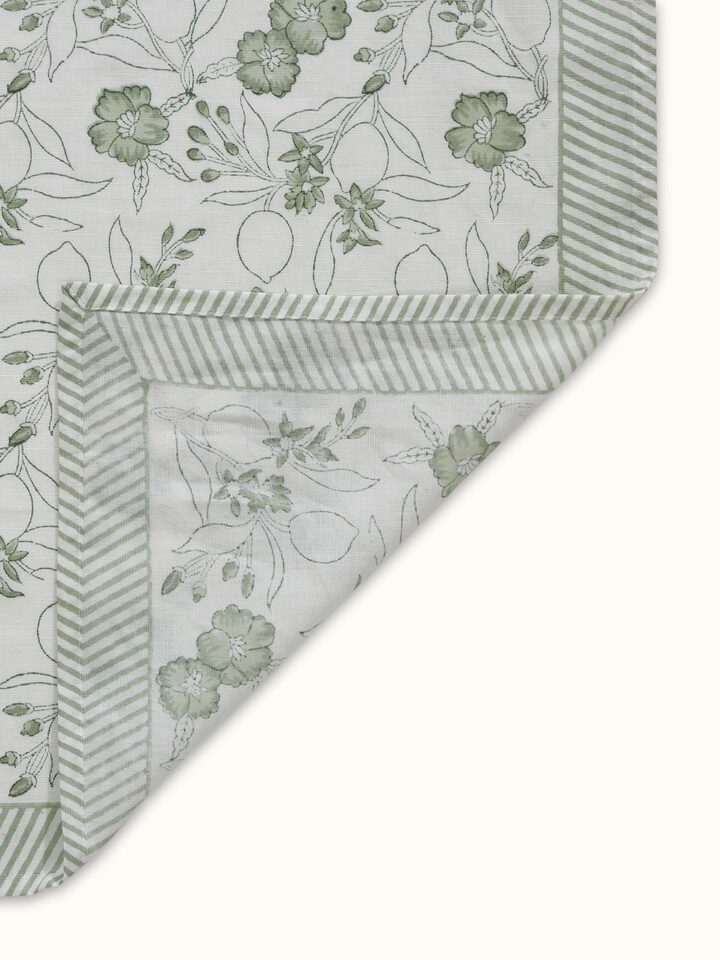 Artistic angle focusing on the interplay of light and texture on the floral printed surface