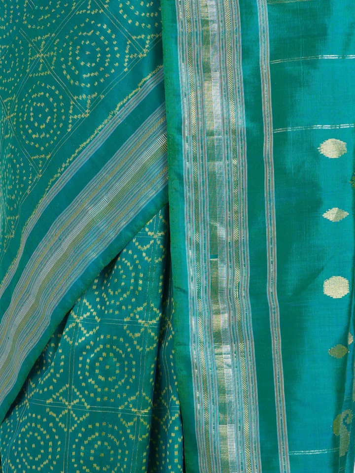 Detailed view of Turquoise Pochampally Double Ikat Saree focusing on the fine craftsmanship and texture