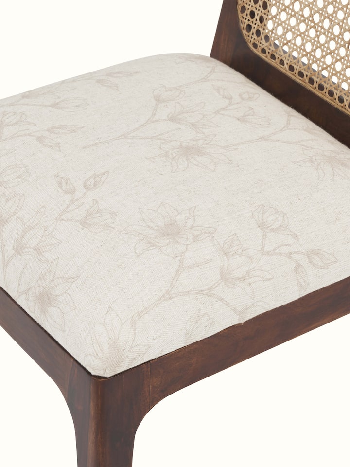 Close-up view of Sheesham Wood & Cane Dining Chair showcasing the detailed cane weaving and smooth wood finish.