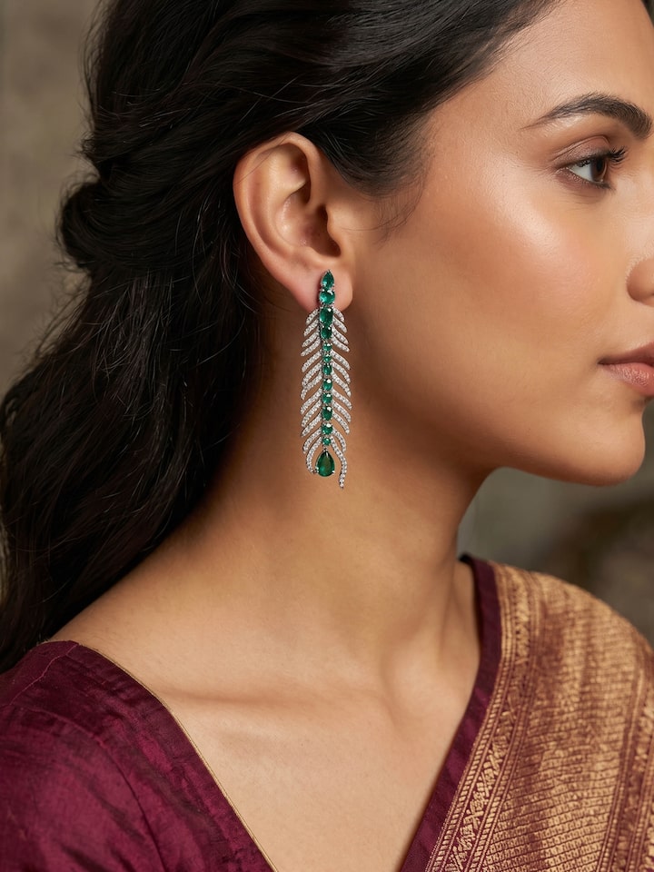 Styled view of Silver Smithing Drop Earrings worn on the ear, showing how it looks styled, from a different angle
