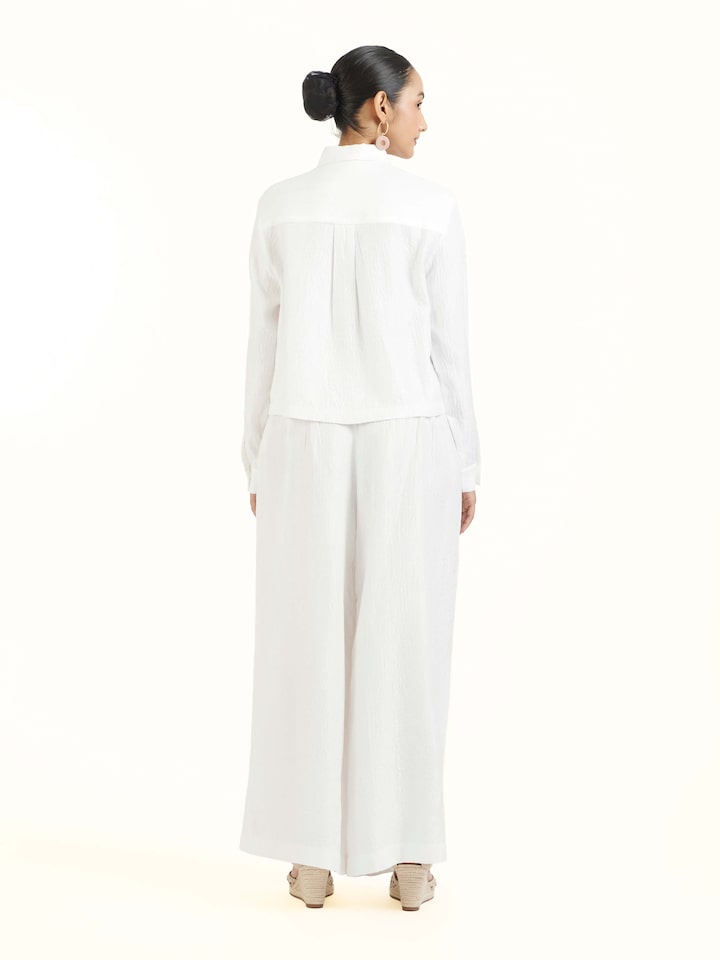 Back view of ivory quilted silk shirt displaying clean finish