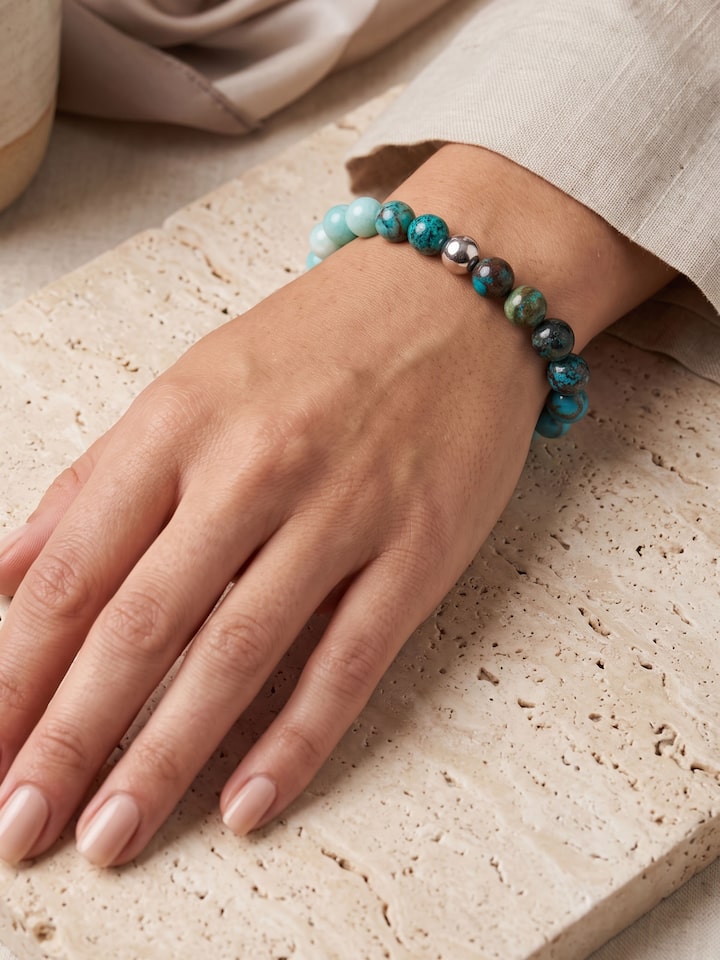 Styled view of Gemstone Silver Turquoise, Amazonite and Chrysocolla Bead Silver Bracelet worn on the wrist, showing how it looks styled