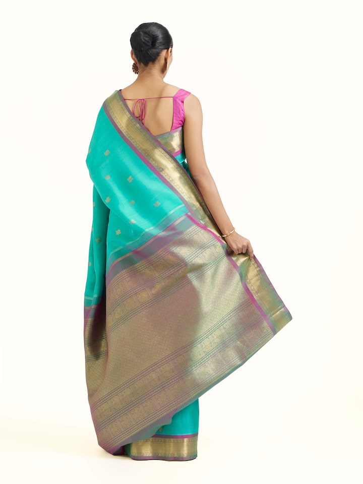 Back view of blue silk Kancheepuram saree displaying ornate pallu design