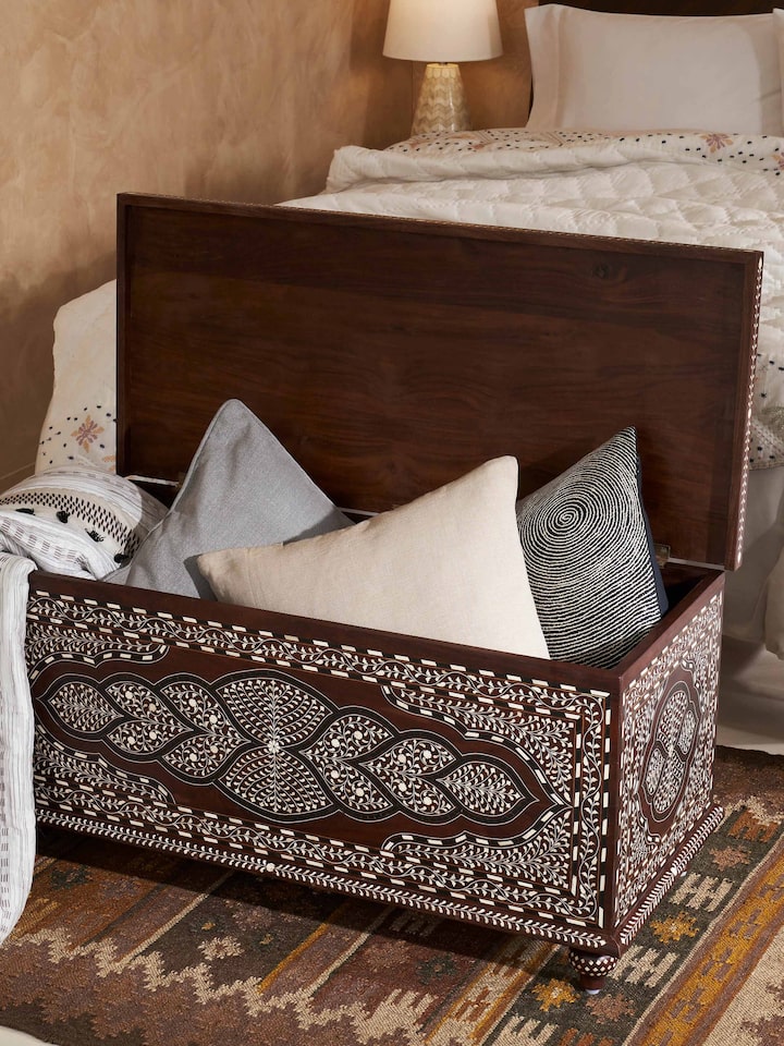 Angled view of Sheesham Wood Bone Inlay Turned Leg Trunk showcasing the fine craftsmanship and traditional design.