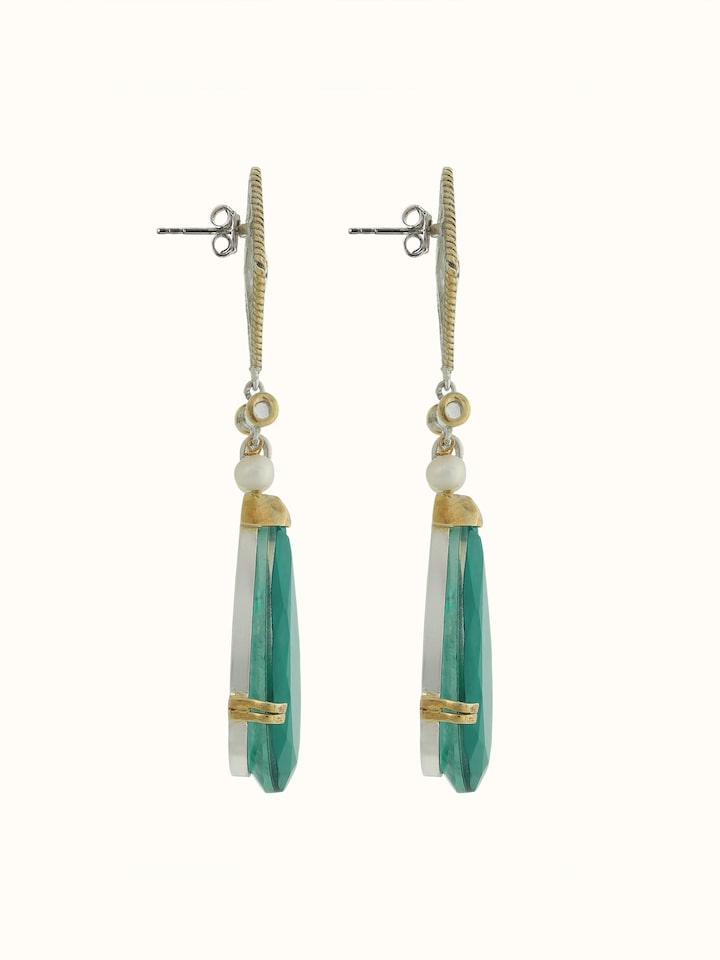 Side view of silver smithing drop earrings