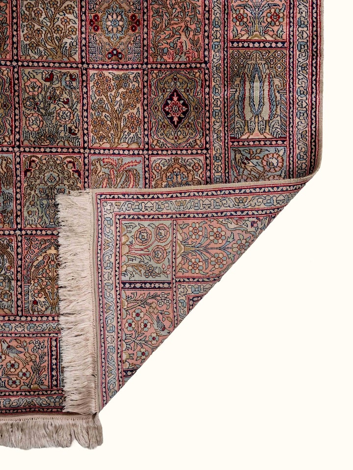 Back view of Traditional Persian Rust Dabdar Kashmir Silk Hand-Knotted Carpet showing the reverse weave