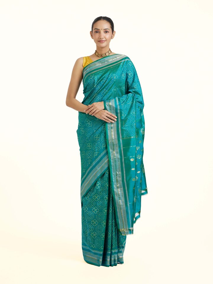Front view of Turquoise Pochampally Double Ikat Saree showcasing its traditional craftsmanship and design