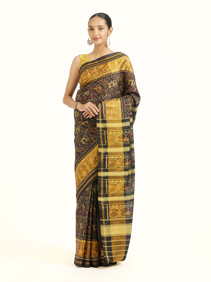 Side view of Rajkot Patola Ikat Saree highlighting the detailed craftsmanship and elegant silhouette