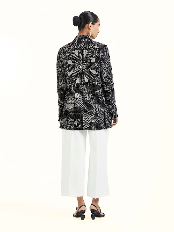 Back view of black silk kantha jacket displaying overall design
