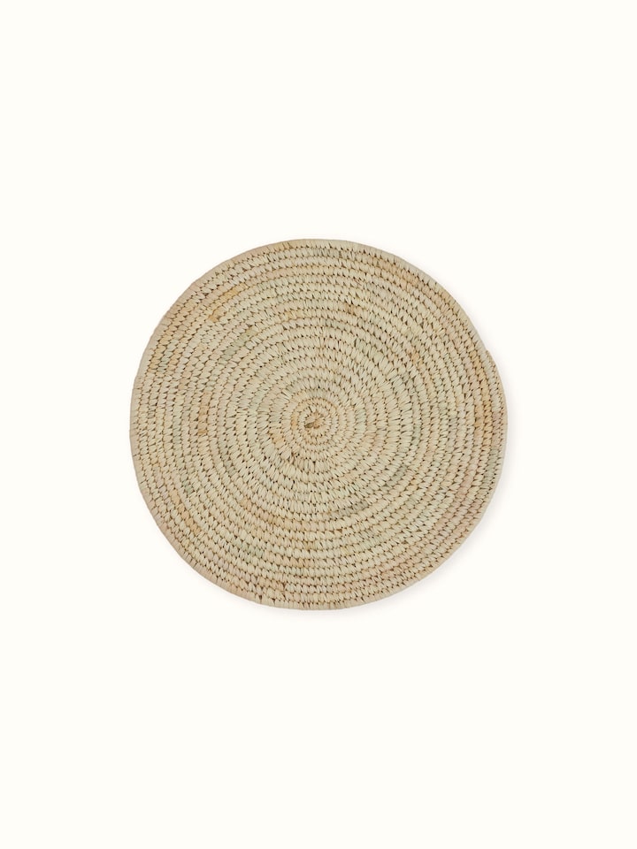 Angled side shot emphasizing the natural earthy texture and solid light green tone of the Sabai grass mats
