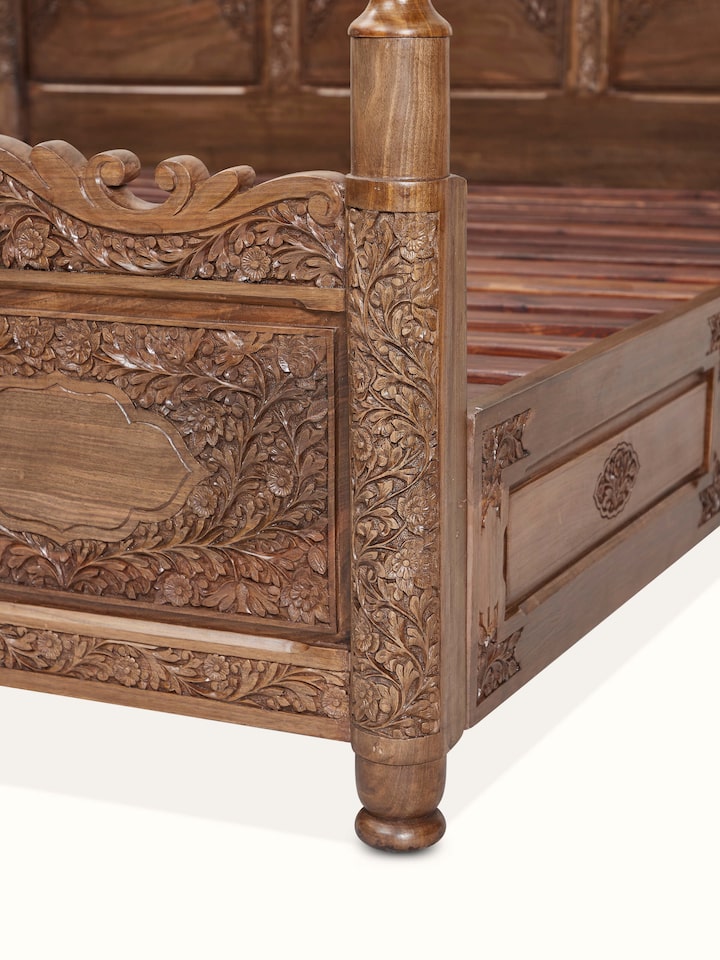 Front view of Carved Walnut Wood Poster Bed showing the front design and silhouette, in an alternate close-up