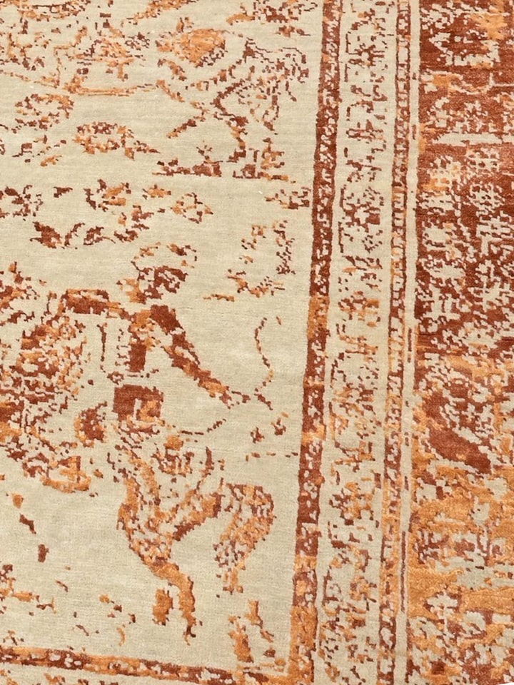 Detail view of Transitional Persian Ivory Rust Shikargah Bhadohi Wool & Bamboo Silk Hand Knotted Rug highlighting the intricate pattern and pile te...