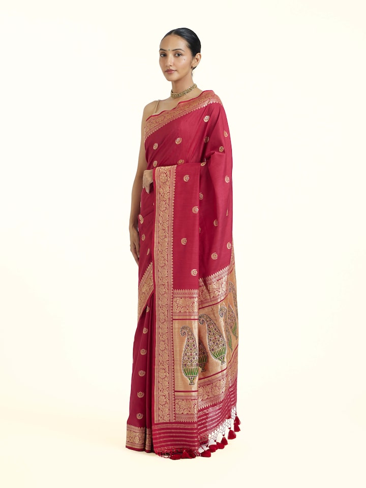 Side view of Pink Ashavali Brocade Silk Saree highlighting the detailed craftsmanship and elegant silhouette